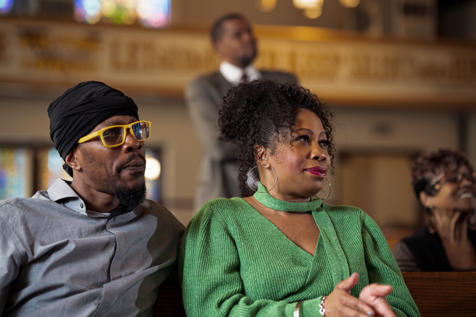 Young Man and Woman Sitting in a Church Service